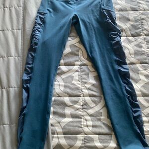 Fabletics Blue Leggings with Side mesh Panels and pockets.